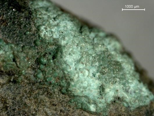 Microfotografia di prodotti di corrosione di una moneta in oricalco di epoca augustea